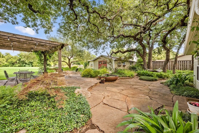 1432 Cimarron Trl, Hurst, TX 76053 - view of yard with a pergola, an outdoor structure, and a patio area