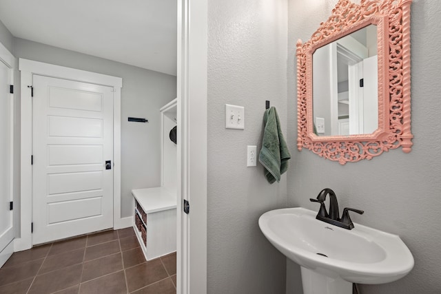 1432 Cimarron Trl, Hurst, TX 76053 - bathroom featuring a sink and tile patterned flooring