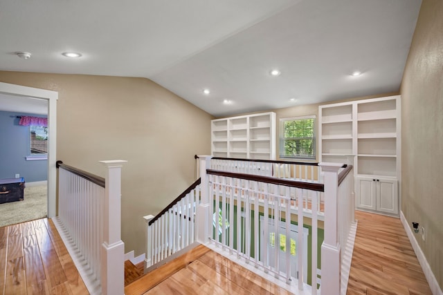1432 Cimarron Trl, Hurst, TX 76053 - stairway with wood finished floors, lofted ceiling, baseboards, and recessed lighting