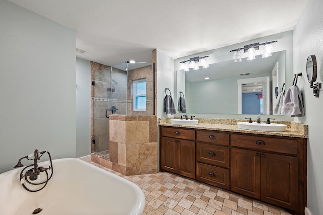 1432 Cimarron Trl, Hurst, TX 76053 - full bathroom with a stall shower, double vanity, a freestanding tub, and stone finish floors