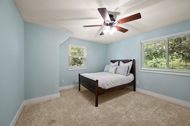 1432 Cimarron Trl, Hurst, TX 76053 - bedroom with carpet flooring, a ceiling fan, and baseboards