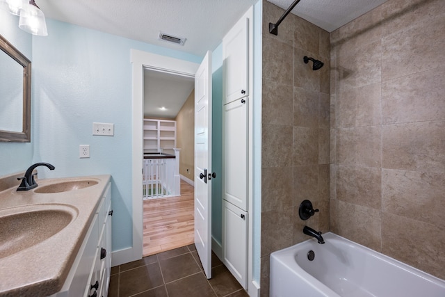 1432 Cimarron Trl, Hurst, TX 76053 - full bathroom with bathing tub / shower combination, tile patterned floors, double vanity, baseboards, and a closet