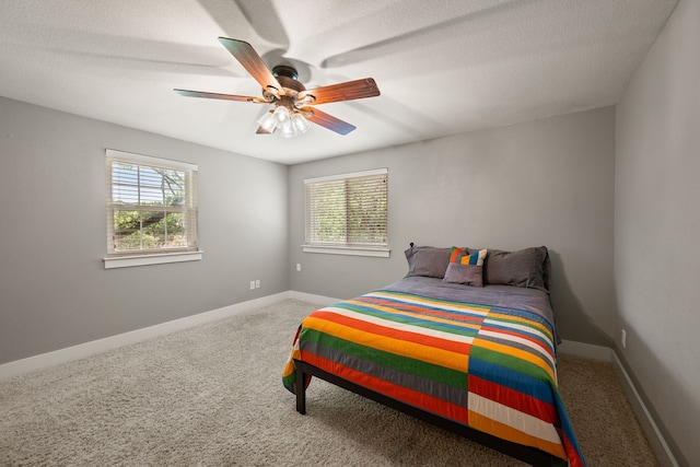 1432 Cimarron Trl, Hurst, TX 76053 - bedroom with carpet floors, ceiling fan, a textured ceiling, and baseboards