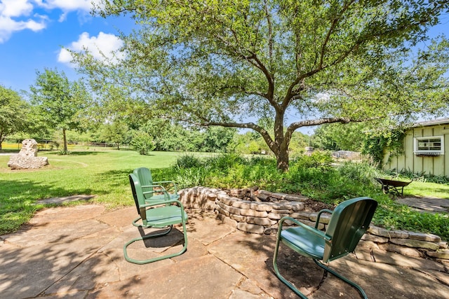 1432 Cimarron Trl, Hurst, TX 76053 - view of patio featuring a fire pit