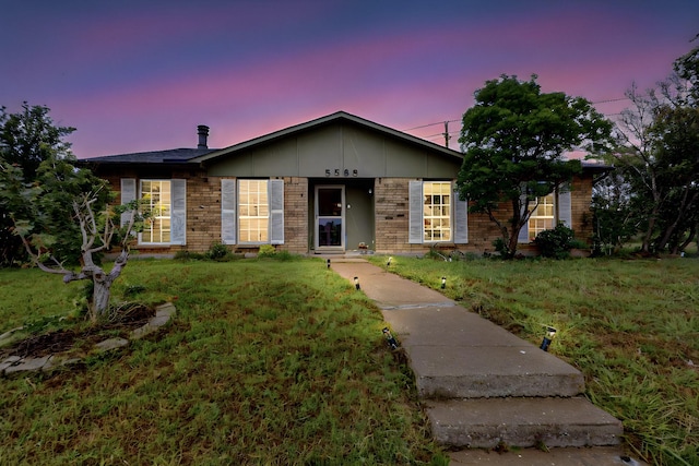 5588 Squires Dr, The Colony, TX 75056 - ranch-style home with brick siding and a yard