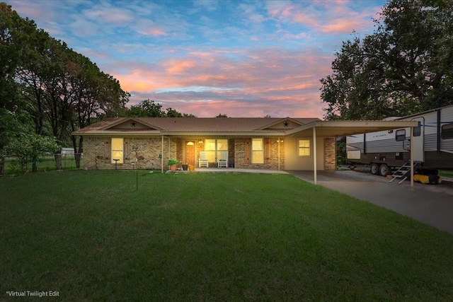 1038 S Old Robinson Rd, Robinson, TX 76706 - back of house at dusk featuring an attached carport and covered porch