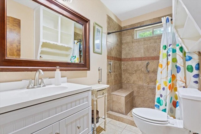 1038 S Old Robinson Rd, Robinson, TX 76706 - bathroom featuring toilet, tiled shower, vanity, and tile patterned flooring