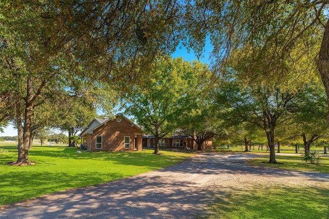 11000 Saint John Rd, Pilot Point, TX 76258 - view of front facade with dirt driveway and a front yard