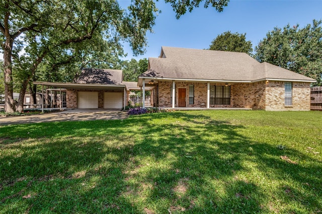 1521 Etain Rd, Irving, TX 75060 - view of front facade featuring a garage, driveway, brick siding, and a front yard