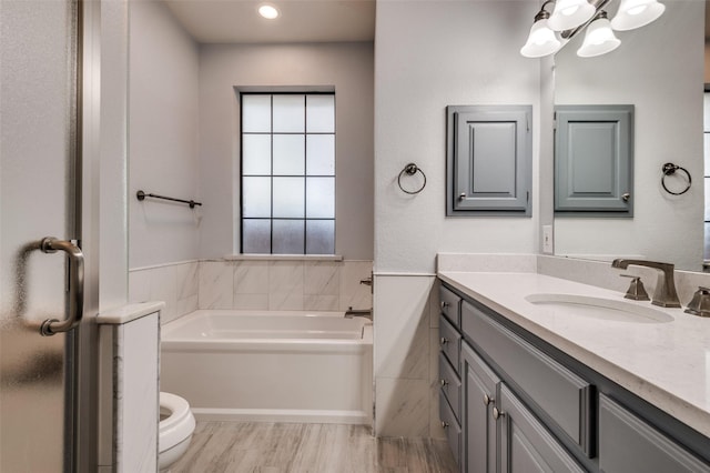 1521 Etain Rd, Irving, TX 75060 - full bathroom featuring vanity, a garden tub, toilet, and wood finished floors