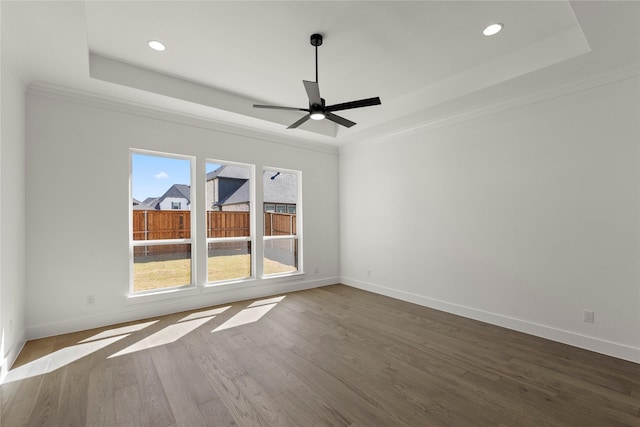 16322 Old Westbury Ln, Frisco, TX 75033 - unfurnished room featuring a raised ceiling, ornamental molding, baseboards, dark wood finished floors, and recessed lighting