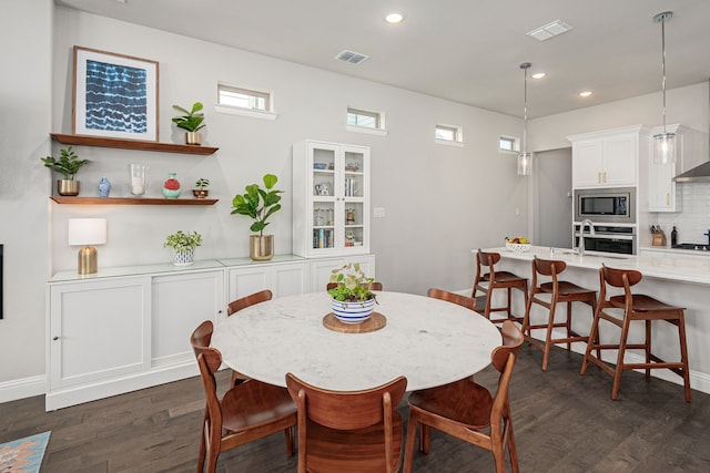 4258 Sechrist Dr, Frisco, TX 75034 - dining area with dark wood-style flooring and recessed lighting