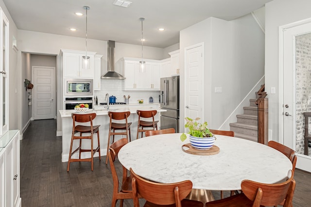 4258 Sechrist Dr, Frisco, TX 75034 - dining room featuring stairway, dark wood-style floors, and recessed lighting