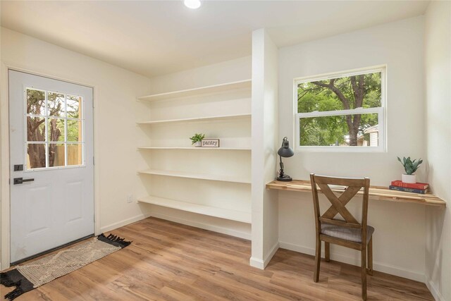 1534 Burger St, Abilene, TX 79603 - doorway featuring healthy amount of natural light, wood finished floors, an office area, and baseboards