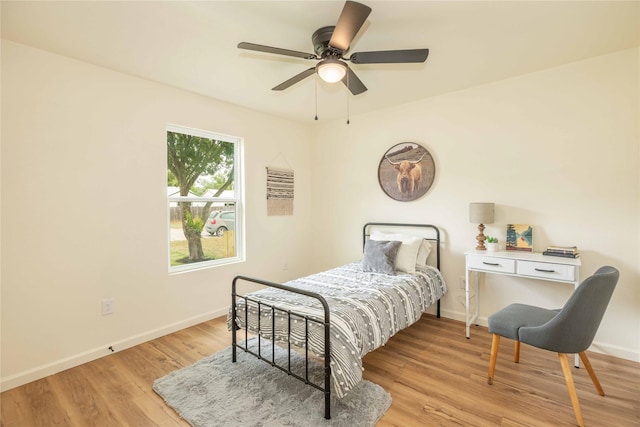 1534 Burger St, Abilene, TX 79603 - bedroom featuring baseboards, wood finished floors, and a ceiling fan