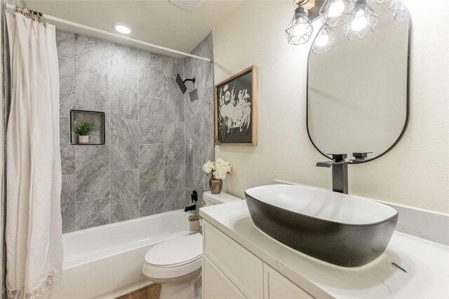 1534 Burger St, Abilene, TX 79603 - bathroom featuring shower / bath combination with curtain, vanity, and toilet