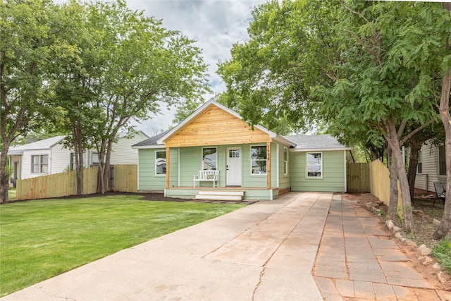 1534 Burger St, Abilene, TX 79603 - view of front of house with roof with shingles, a porch, and concrete driveway