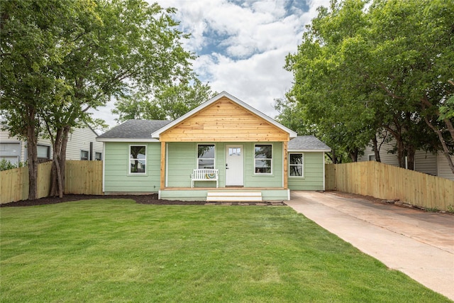 1534 Burger St, Abilene, TX 79603 - bungalow with a porch, a shingled roof, and concrete driveway