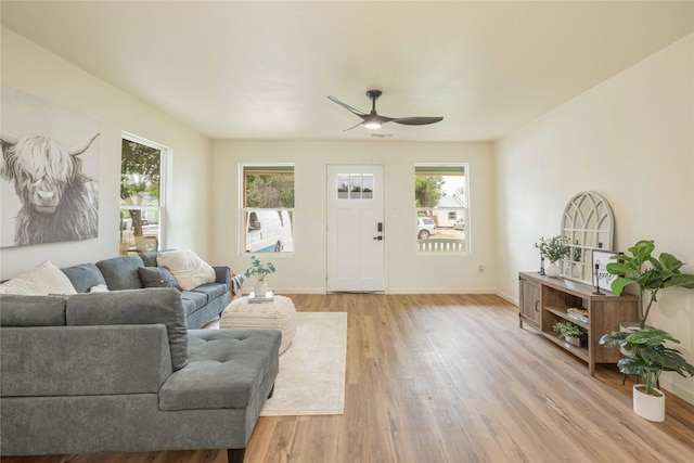 1534 Burger St, Abilene, TX 79603 - living area with ceiling fan, light wood-style flooring, and baseboards