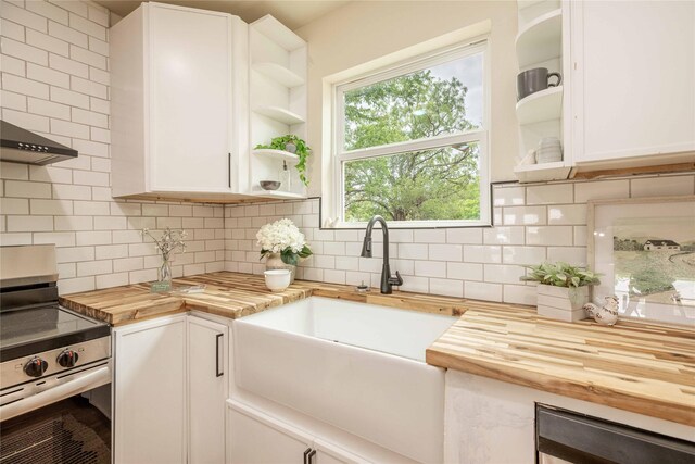 1534 Burger St, Abilene, TX 79603 - kitchen with wooden counters, electric range, open shelves, and a sink