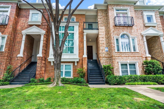 2205 Canton St Unit 107, Dallas, TX 75201 - multi unit property with stairs, a front yard, and brick siding