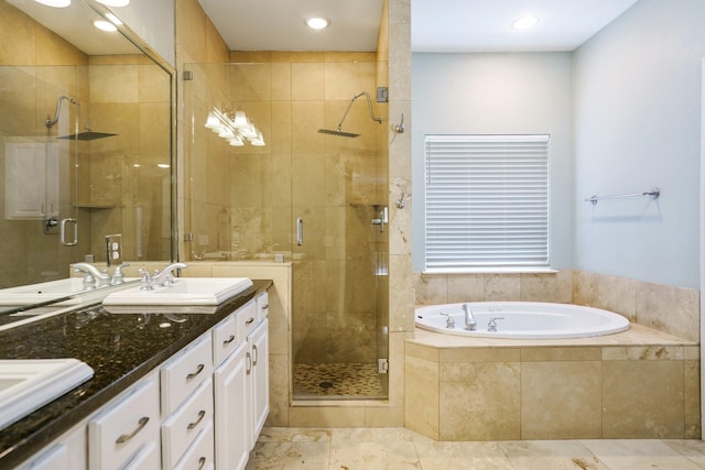 2205 Canton St Unit 107, Dallas, TX 75201 - bathroom featuring double vanity, a stall shower, a garden tub, and recessed lighting