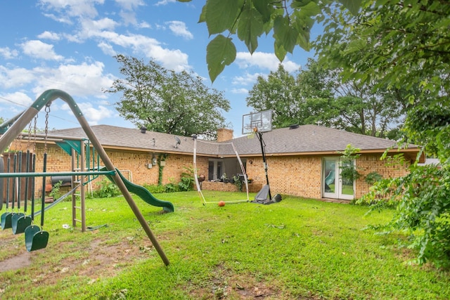 801 Daventry Dr, Garland, TX 75040 - rear view of property featuring a playground, brick siding, french doors, and a chimney