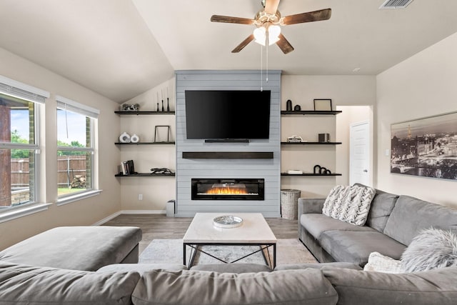 3216 Maroon Creek Rd, Aubrey, TX 76227 - living room with wood finished floors, ceiling fan, lofted ceiling, baseboards, and a fireplace