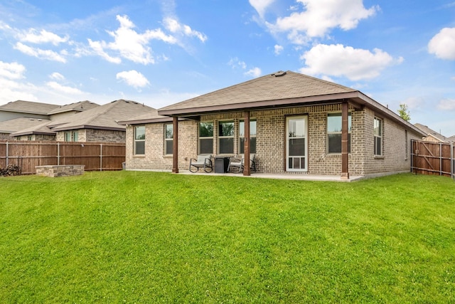 3216 Maroon Creek Rd, Aubrey, TX 76227 - back of property with brick siding and a patio