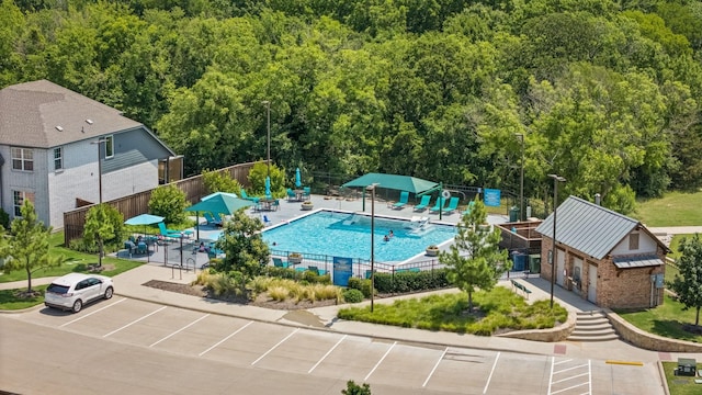 3216 Maroon Creek Rd, Aubrey, TX 76227 - community pool with a forest view and a patio area