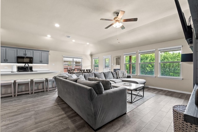 3216 Maroon Creek Rd, Aubrey, TX 76227 - living area featuring lofted ceiling, wood finished floors, ceiling fan, recessed lighting, and baseboards