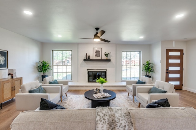 2028 Casa Loma Ct, Grapevine, TX 76051 - living area featuring wood finished floors, a ceiling fan, a brick fireplace, recessed lighting, and baseboards