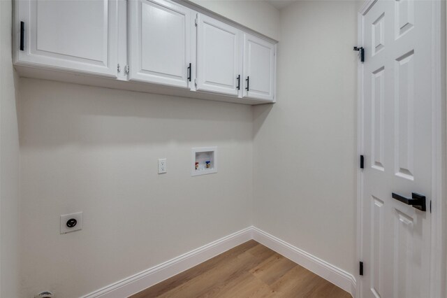 2028 Casa Loma Ct, Grapevine, TX 76051 - washroom with electric dryer hookup, washer hookup, cabinet space, light wood-type flooring, and baseboards