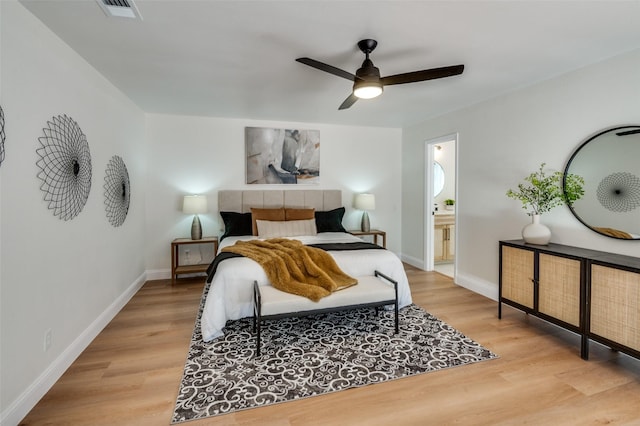 2028 Casa Loma Ct, Grapevine, TX 76051 - bedroom featuring light wood-type flooring, baseboards, ceiling fan, and ensuite bathroom
