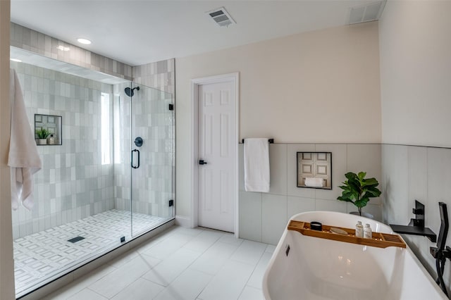 2028 Casa Loma Ct, Grapevine, TX 76051 - bathroom featuring a soaking tub, a shower stall, tile patterned flooring, and a sink