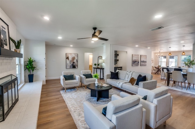 2028 Casa Loma Ct, Grapevine, TX 76051 - living room featuring a fireplace, light wood-style flooring, recessed lighting, ceiling fan, and baseboards