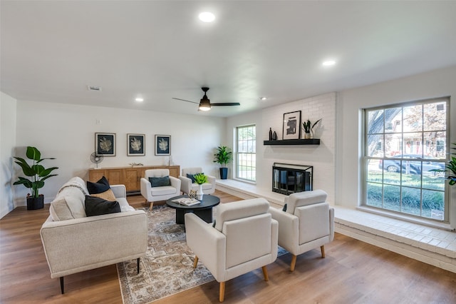 2028 Casa Loma Ct, Grapevine, TX 76051 - living area with light wood-style floors, a fireplace, recessed lighting, ceiling fan, and baseboards