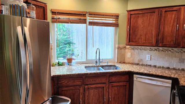 1718 Gentle Wind Dr, Arlington, TX 76018 - kitchen featuring freestanding refrigerator, dishwasher, stove, and plenty of natural light