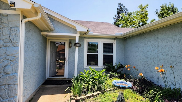 1718 Gentle Wind Dr, Arlington, TX 76018 - entrance to property featuring stone siding and stucco siding