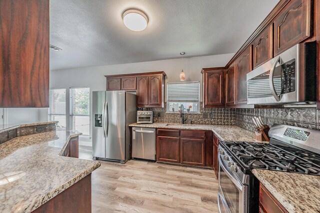 6204 Geneva Ln, Fort Worth, TX 76131 - view of front of home with brick siding, driveway, and a garage