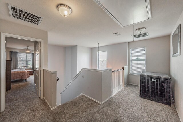 6204 Geneva Ln, Fort Worth, TX 76131 - kitchen with appliances with stainless steel finishes, light wood-style floors, arched walkways, a peninsula, and light stone counters