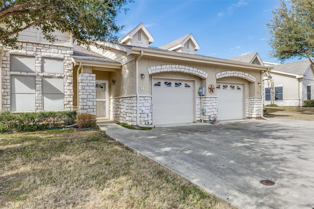 871 Kitty Hawk Ln, Grand Prairie, TX 75051 - view of front of home featuring stone siding, a garage, driveway, stucco siding, and roof with shingles