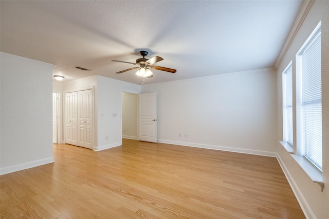 871 Kitty Hawk Ln, Grand Prairie, TX 75051 - unfurnished room featuring ceiling fan, light wood finished floors, ornamental molding, and baseboards