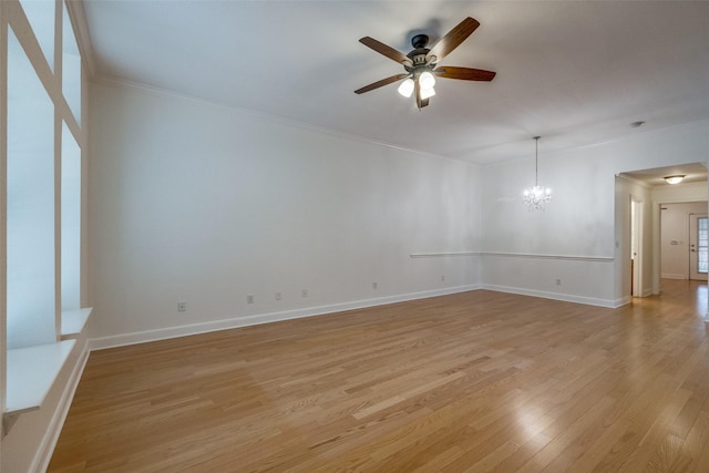 871 Kitty Hawk Ln, Grand Prairie, TX 75051 - empty room with crown molding, ceiling fan, light wood finished floors, a chandelier, and baseboards