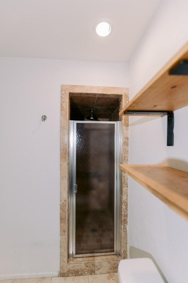 6646 E Lovers Ln Unit 301, Dallas, TX 75214 - bathroom with a shower stall and tile patterned floors