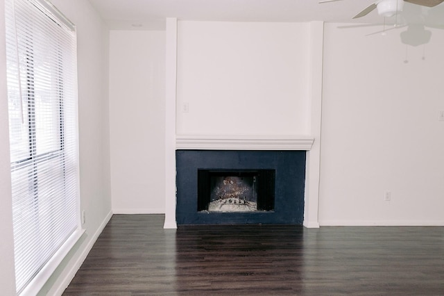 6646 E Lovers Ln Unit 301, Dallas, TX 75214 - detailed view of wood finished floors, a ceiling fan, a fireplace, and baseboards