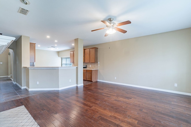 7001 Bickers Dr, Rowlett, TX 75089 - unfurnished living room with dark wood finished floors, ceiling fan, baseboards, and recessed lighting