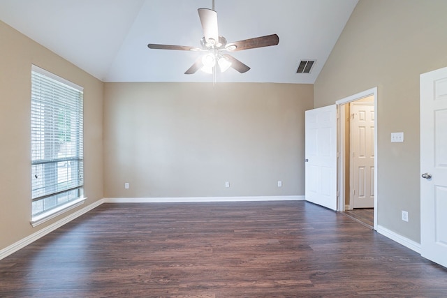 7001 Bickers Dr, Rowlett, TX 75089 - spare room with vaulted ceiling, a ceiling fan, dark wood-style floors, and baseboards