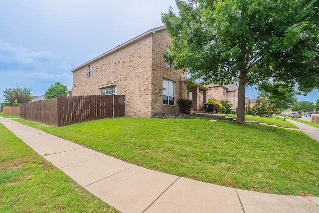 7001 Bickers Dr, Rowlett, TX 75089 - view of side of property featuring brick siding