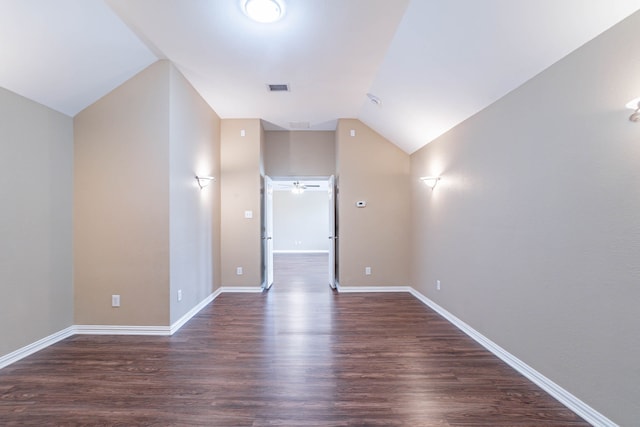 7001 Bickers Dr, Rowlett, TX 75089 - empty room featuring vaulted ceiling, dark wood-style floors, ceiling fan, and baseboards